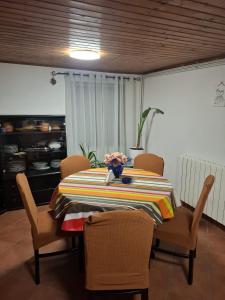 a dining room table with chairs and a table cloth at Holiday Home Izabela in Kršan