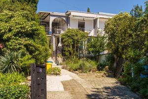 a house with a brick walkway in front of it at House Goran in Crikvenica
