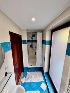 a bathroom with a shower and a shower curtain at Apartmán v Dráze in Zásada +16 photos