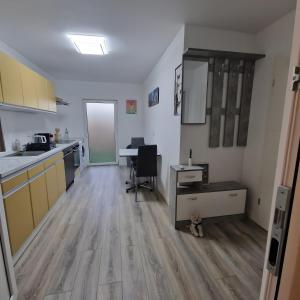 a kitchen with a desk and a table in a room at Monteurzimmer Wohnung in Dillingen an der Saar +15 photos