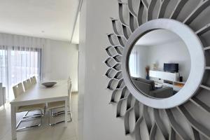 a mirror on a wall in a living room at Apartment - Casa Andres in Salir de Porto