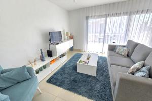a living room with a couch and a tv at Apartment - Casa Andres in Salir de Porto