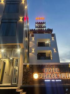 a hotel with a sign on the side of a building at Hotel Pushkar Pulse in Pushkar