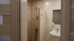a bathroom with a sink and a shower at Dilichella Resort in Dilijan