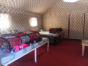 a bedroom with two beds in a tent at HIMALAYAN ESCAPE CAMP chopta in Chopta +18 photos