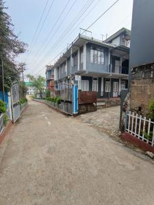 an empty street in front of a house at LeeZaiah in Shillong