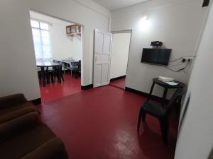 a living room with a couch and a table at LeeZaiah in Shillong