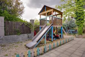 a small playground with a slide in a park at Hedi in Mtskheta
