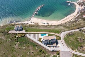 an aerial view of a house next to the ocean at Calithea Residence in Kavarna