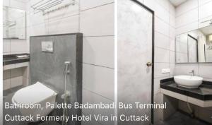 a bathroom with a sink and a toilet and a mirror at Hotel Vira in Cuttack