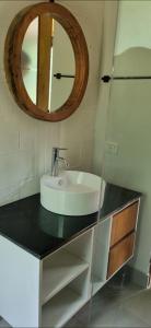 a bathroom with a sink and a mirror at Loft La Misión in Salta
