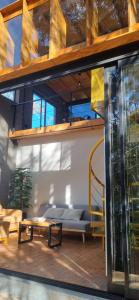 a room with a bunk bed and a couch at Loft La Misión in Salta +10 photos
