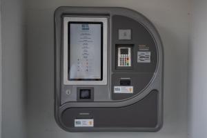 a close up of a atm machine against a wall at Hotel B&B Stossplatz anytime and easy self Check-in in Appenzell