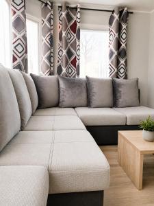 a living room with a couch and a table at Au 7cent14 in Marcilly-sur-Eure