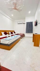 a bedroom with a large bed in a room at Shreevanya Inn in Ayodhya