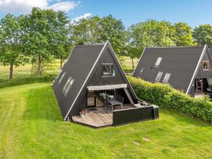 an overhead view of a home with a black roof at 4 star holiday home in Farsø in Farsø