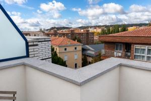a view of a city from a balcony at Hotel Cardeña by gaiarooms in Burgos