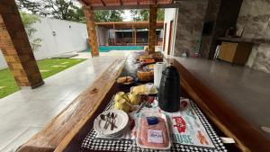 a picnic table with food on top of it at Casa Paraíso de Alter in Santarém