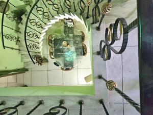 a close up of a clock on a wall at The Green Villa in Ludhiana +18 photos