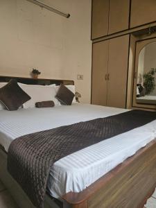 a bedroom with a large bed in a room at The Green Villa in Ludhiana
