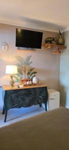 a room with a table with a lamp on it at chambres d'hôtes Les Fenières in Sainte-Croix-de-Verdon +27 photos