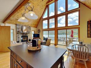 a kitchen and living room with large windows at Sunny Boy in McHenry