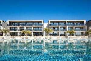 an image of a resort with a swimming pool at Residence Del Mar Emotion in Pula