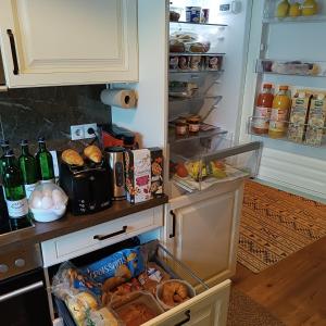 an open refrigerator filled with lots of food and drinks at Brilliant Home Messe in Nuremberg