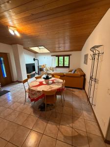 a living room with a table and a couch at Appartamenti Posse- Verzasca in Lavertezzo