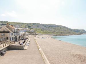 a view of a beach with buildings and the ocean at Seaview Portland in Portland