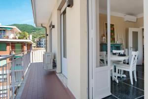 a balcony with a table and chairs on a building at Casa La Perla in Rapallo