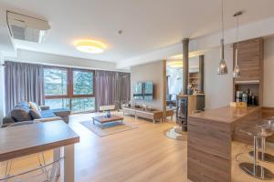 a living room with a couch and a table at Mierki da Marco in Mörken +25 photos