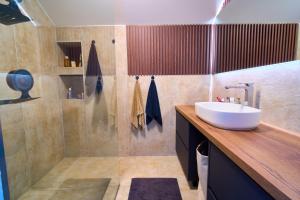 a bathroom with a sink and a shower at Skyline Skadar Lake in Karuč +36 photos