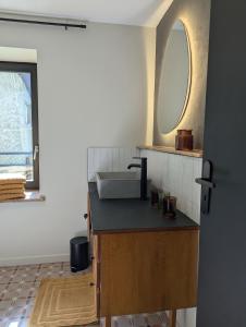 a bathroom with a sink and a mirror at Les Chapeliers in Foix +26 photos