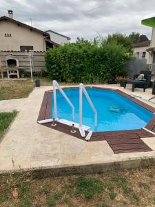 a small swimming pool with two metal bars around it at Mady in Villeneuve-sur-Lot +10 photos