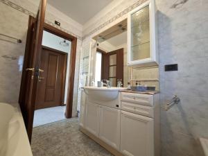 a bathroom with a sink and a mirror and a shower at Villa Romea in Guidizzolo +39 photos