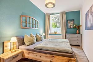 a bedroom with a bed and a window at Ferienhof Schönberg in Lindow