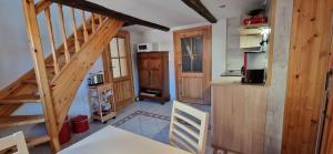 a kitchen with a staircase in a house at Fewo2-Fliegenpilz in Bad Suderode