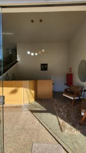 a living room with a couch and a table at Golden Silver UNIQUE in Curvelo