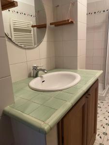 a bathroom with a sink and a mirror at Casa Lago di Brulli in Casole dʼElsa