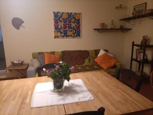 a table with a vase of flowers on a napkin at Casa Lago di Brulli in Casole dʼElsa +19 photos