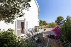 a view of the house from the garden at Apartments with parking space Zavala, Hvar - 8710 in Jelsa