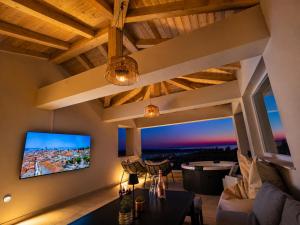 a living room with a view of a city at Villa Lumia in Banjol