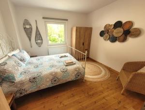 a bedroom with a bed and a window at Chalet Julian in Žaga