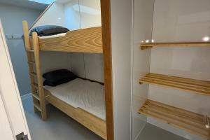 a bunk bed in a small room with a bunk bed gmaxwell gmaxwell gmaxwell at Hopetoun Bothy in Leadhills +16 photos