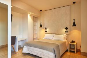 Łóżko lub łóżka w pokoju w obiekcie Hotel Bilbao Plaza