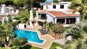an aerial view of a house with a swimming pool at Villa Oasis by Cleverdetails private pool, walk distance in Vilamoura