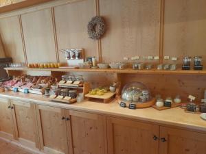 a buffet line with different types of food on display at Hotel Seerose in Rottach-Egern +17 photos