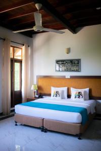 a bedroom with a large bed in a room at The Grand Hanthana in Kandy