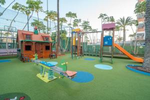 a playground with a slide and a play structure at Bull Escorial & Spa in Playa del Ingles
